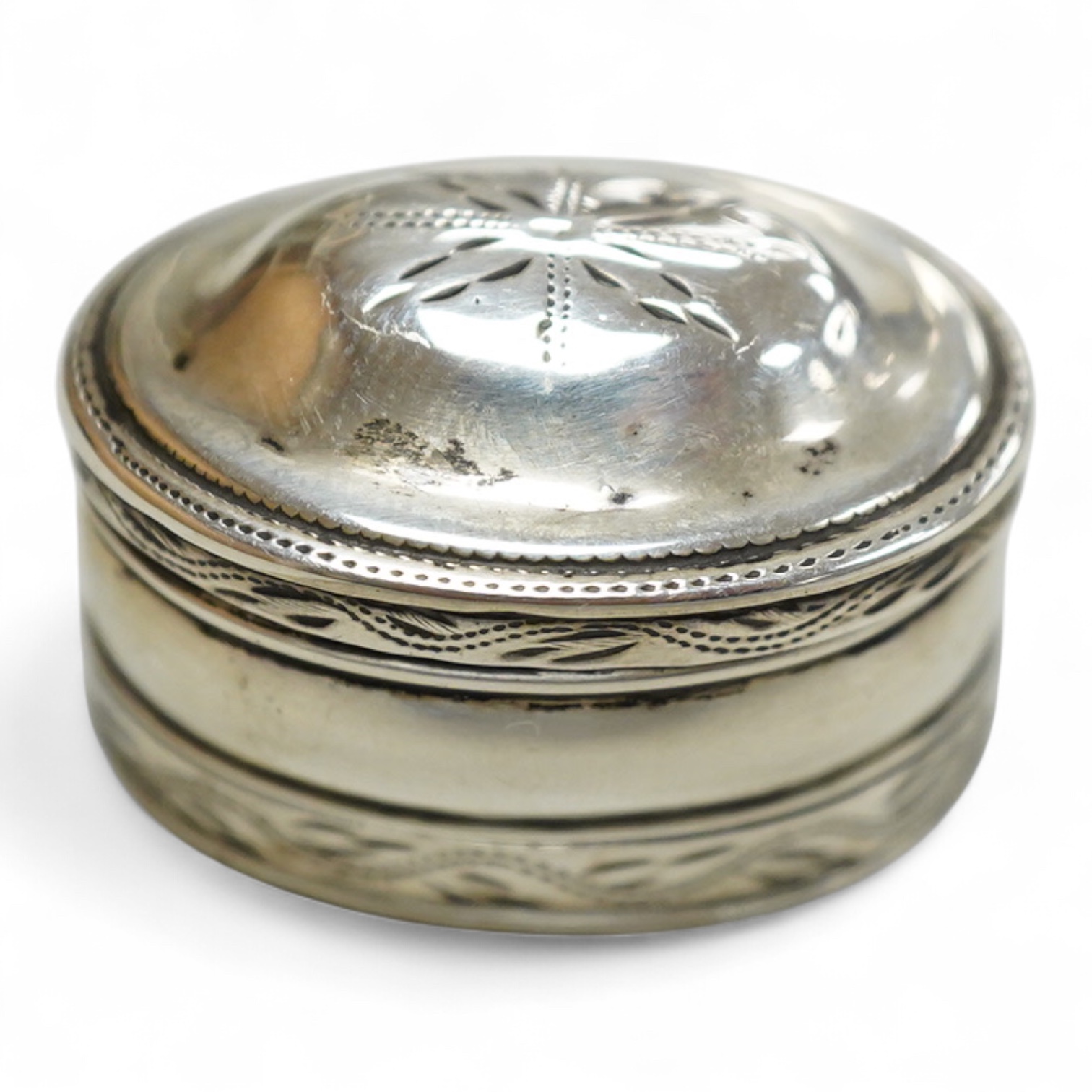 A George III silver oval nutmeg grater by Samuel Pemberton, Birmingham, date letter rubbed, 34mm.